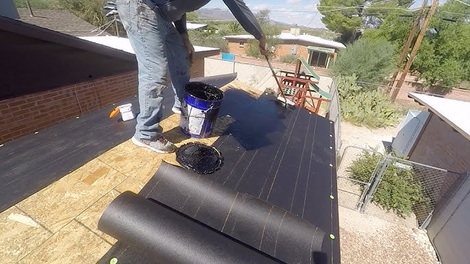 installing felt paper on roof